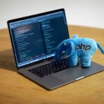 blue elephant figurine on macbook pro